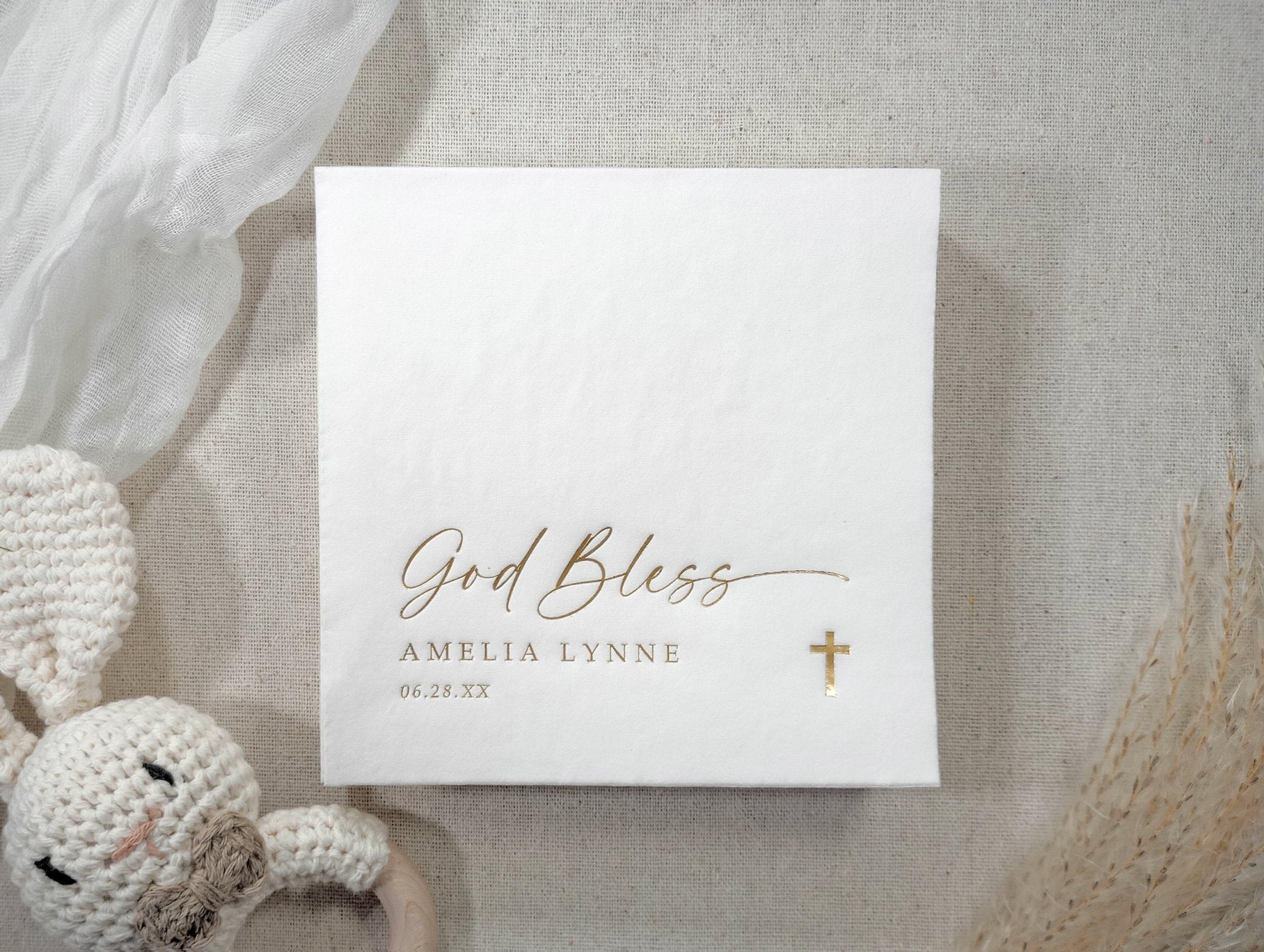White 3-ply baptism beverage napkin with “God Bless” in gold foil and personalized text