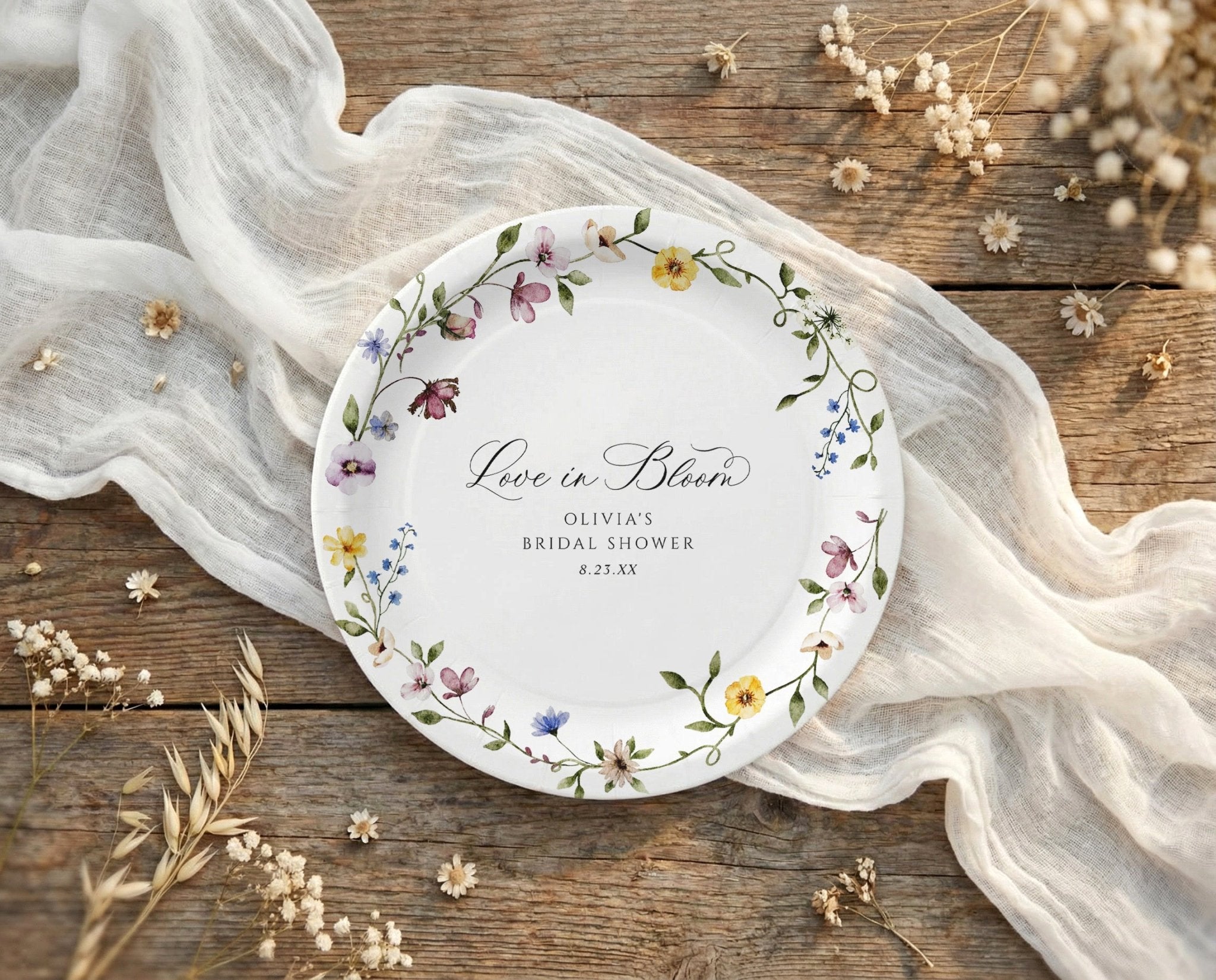 Bridal shower paper plates with watercolor wildflowers and love is in bloom script design