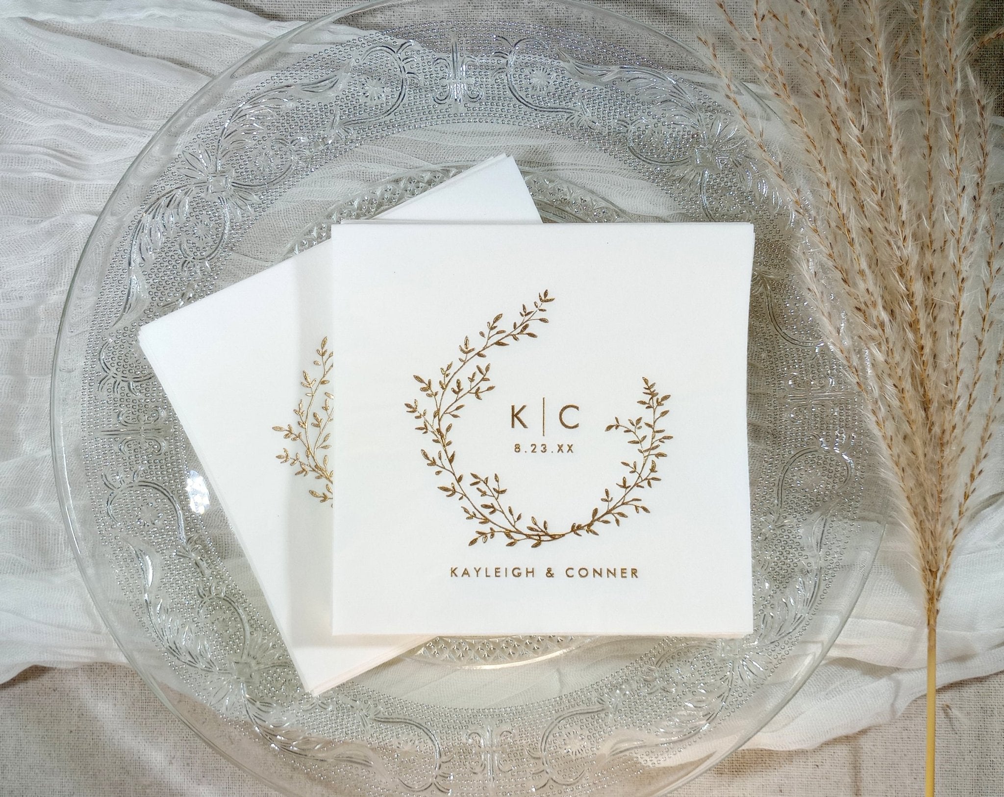 Personalized wedding napkins in gold foil with a boho vintage wreath design