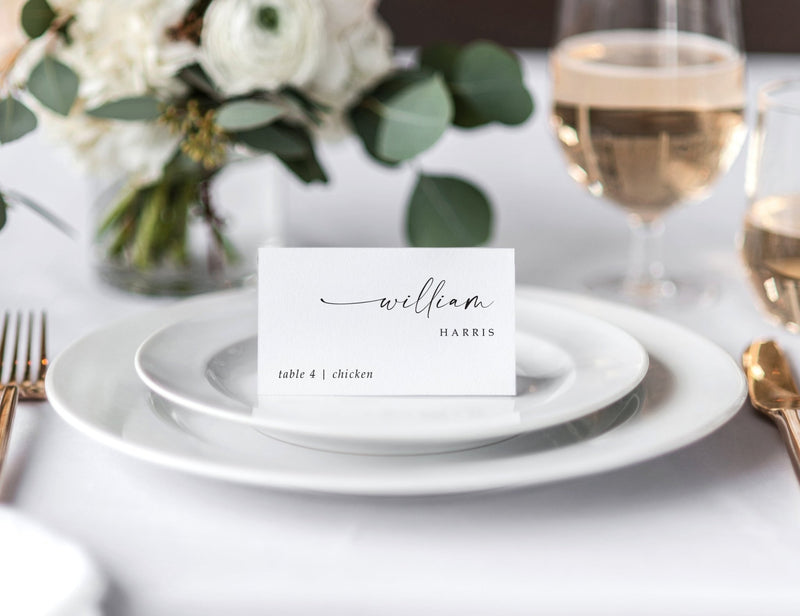 Modern custom wedding place card with guest name and meal choice on white tent cards.