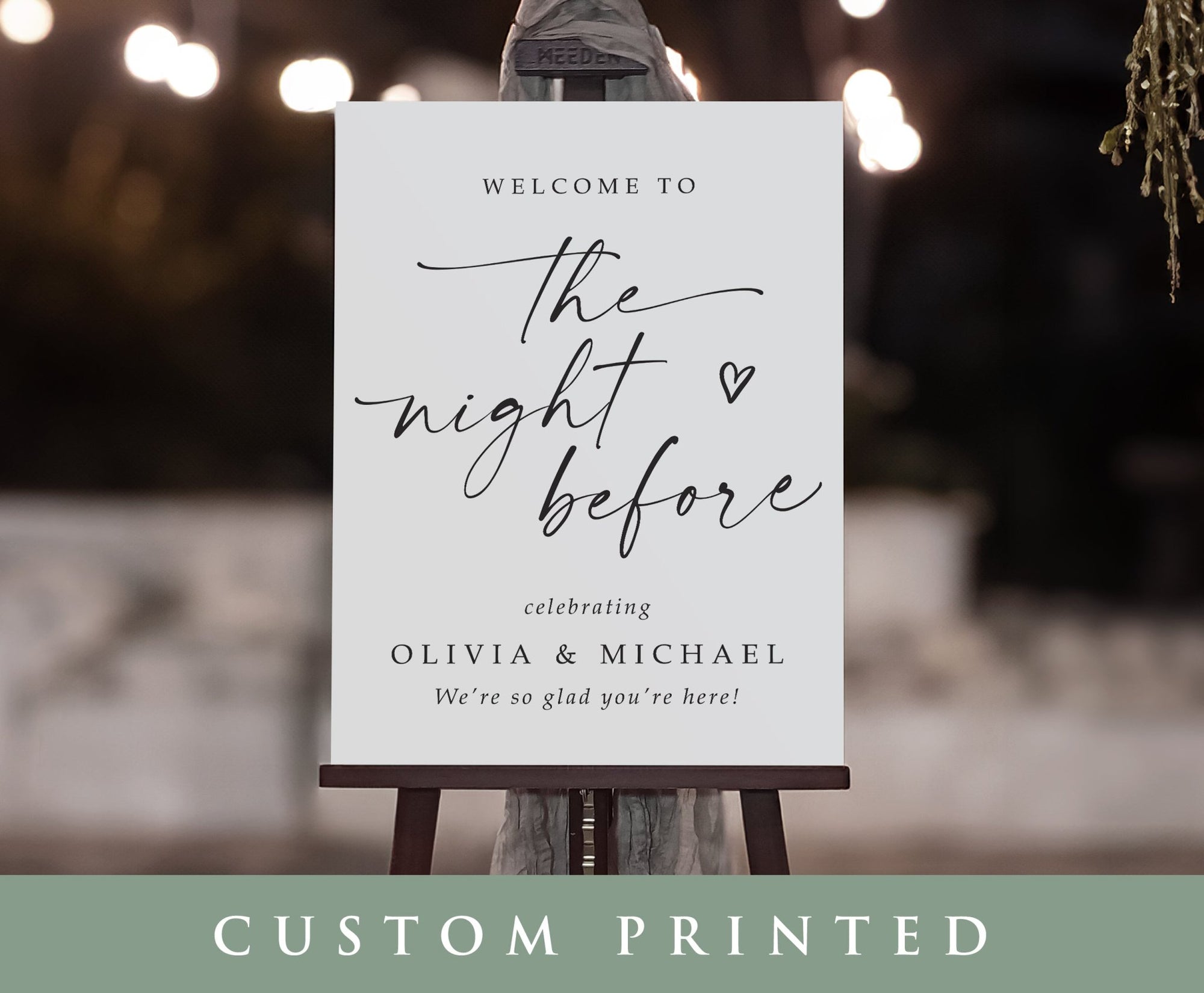 Custom printed sign on an easel with decorative lights in the background