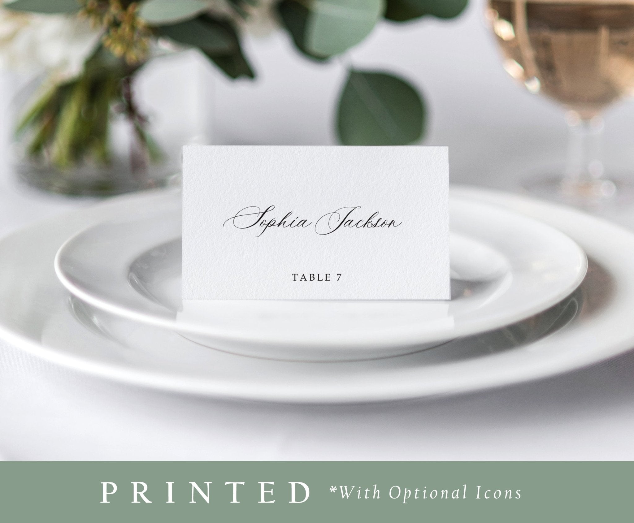 Elegant printed name card placed on a white plate at a formal wedding table setting.