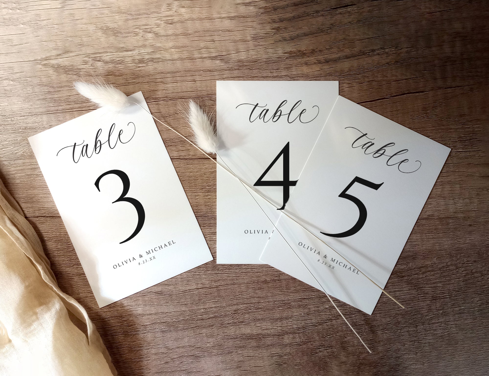 Table number cards on a wooden surface