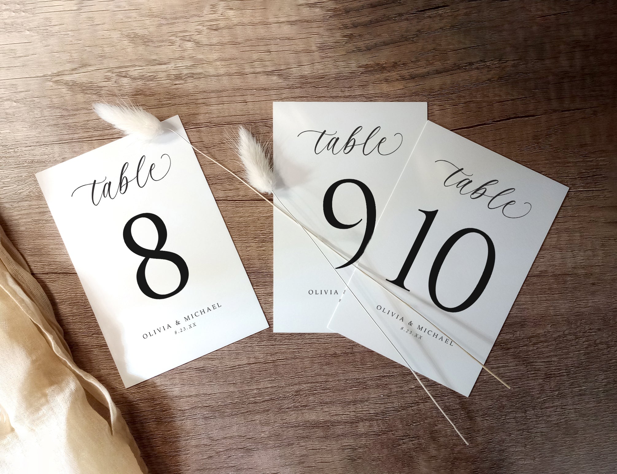 Table number cards on a wooden surface
