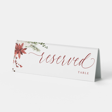 Elegant watercolor Christmas reserved sign with holly berries and greenery design.