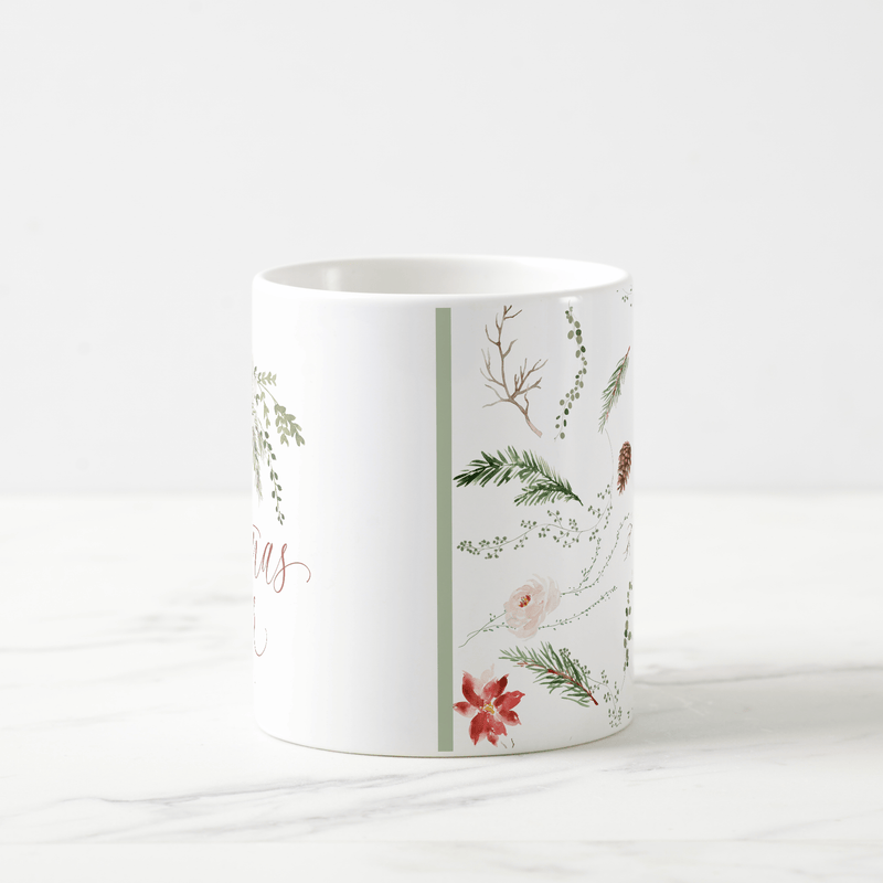 Festive holiday mug featuring watercolor floral and greenery design in red and green tones.