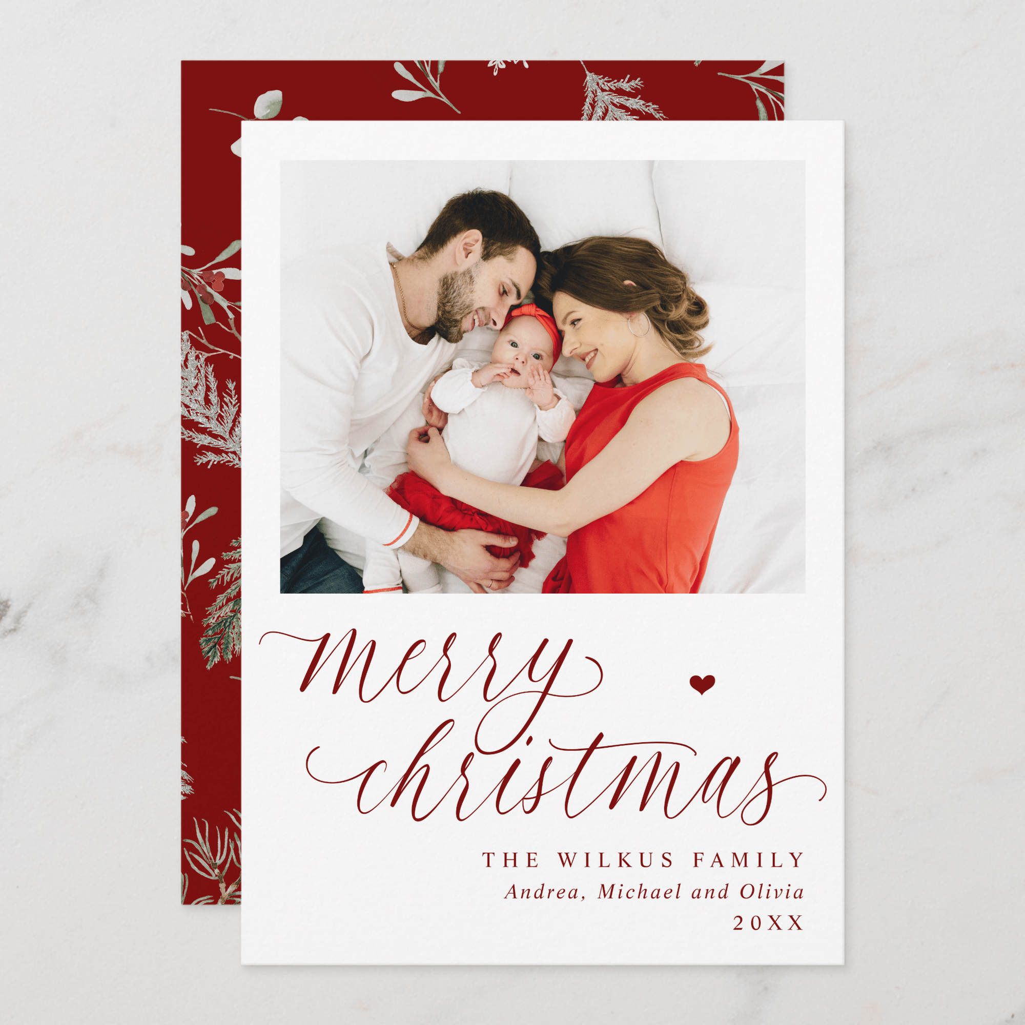 Merry Christmas photo card with elegant script and watercolor foliage accents.