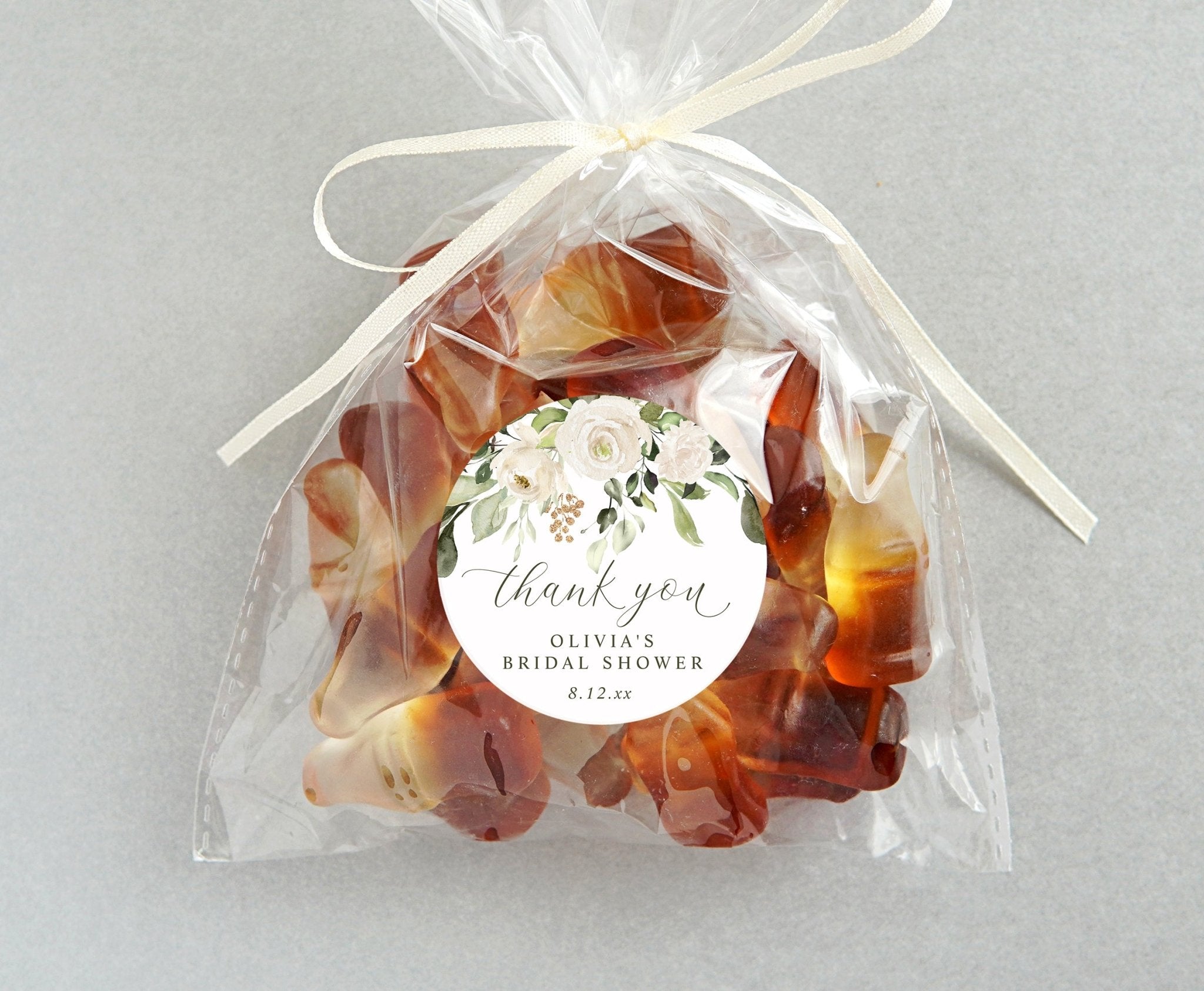 Round sticker with floral design and text for a bridal shower