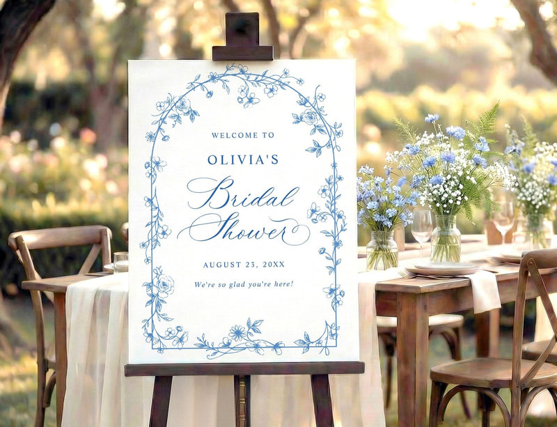 Blue and white wildflower bridal shower welcome sign with French toile floral arch