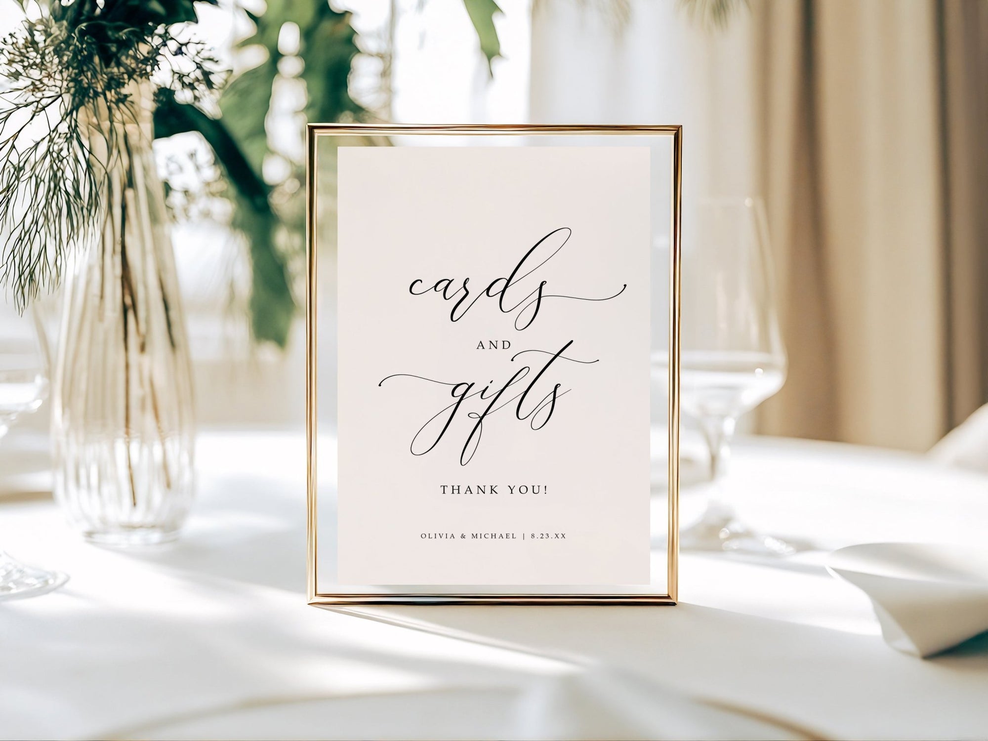Framed card with 'cards and gifts' text on a table with decorative elements