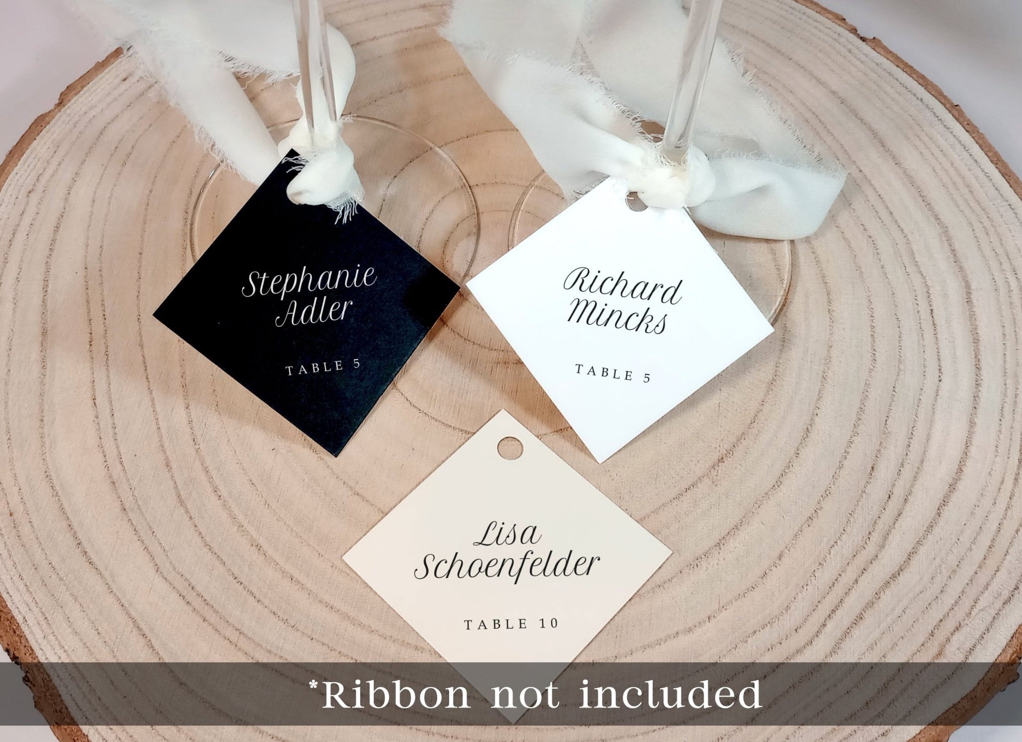assorted name tags for wine glasses with printed guest names in minimalist font