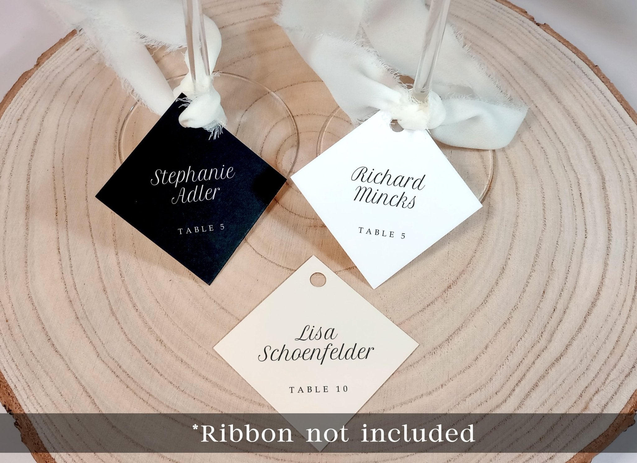 assorted name tags for wine glasses with printed guest names in minimalist font