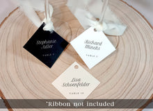 assorted name tags for wine glasses with printed guest names in minimalist font