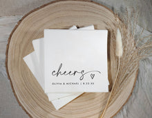 Black and white “cheers” wedding napkins with modern handwriting and heart design