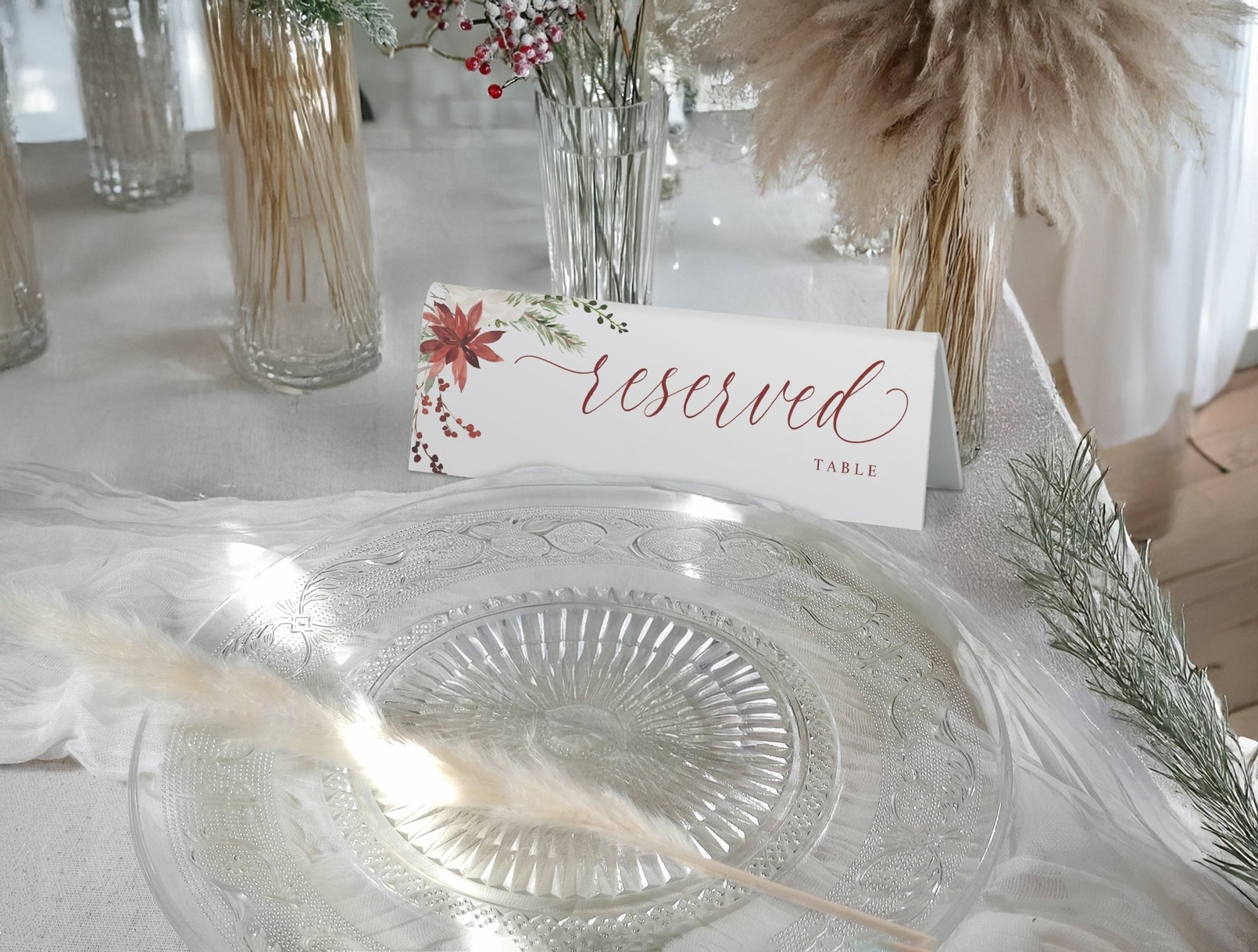Holiday Design Reserved sign on a table setting with decorative elements