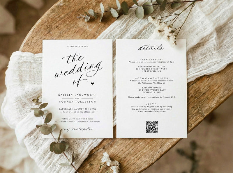 Wedding invitation and details card on a wooden surface with eucalyptus leaves.