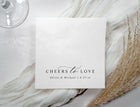 Black and white wedding napkins with elegant calligraphy text “cheers to love” in modern minimalist style