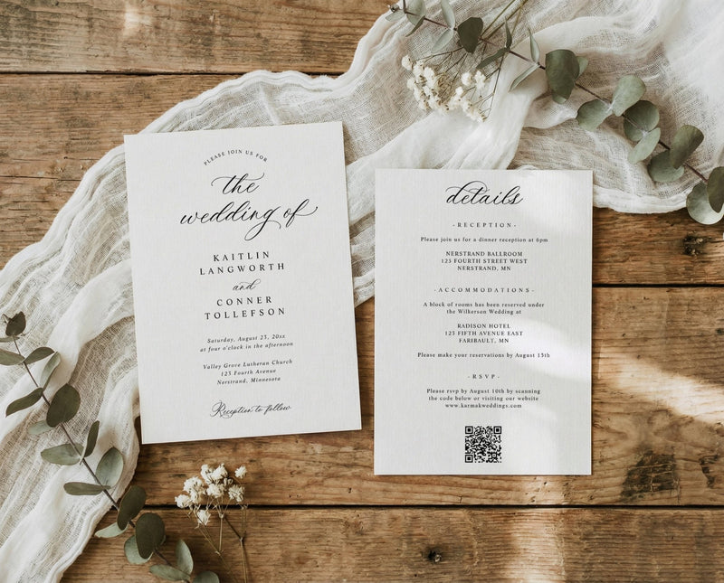 Wedding invitation and details card on a wooden surface with eucalyptus leaves.