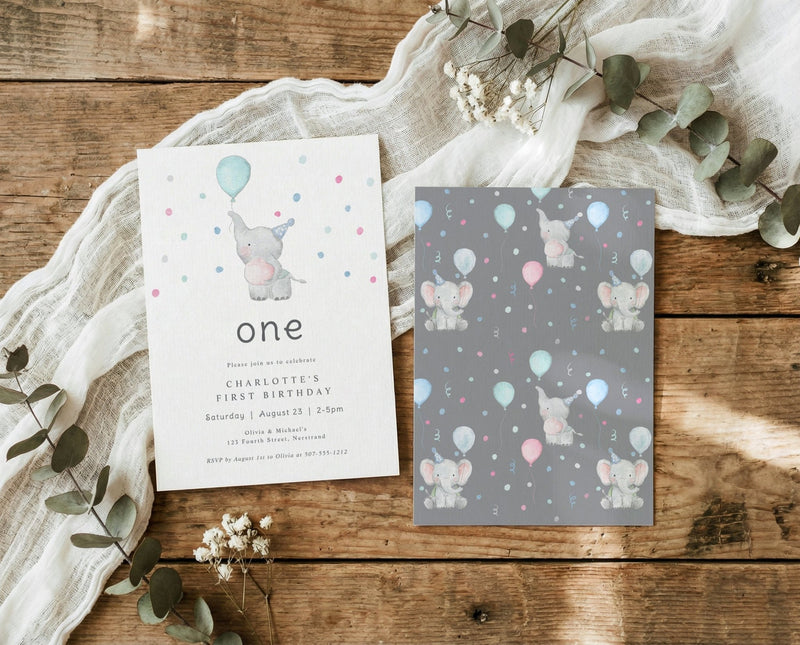 Two birthday invitations with elephants and balloons on a wooden surface with eucalyptus leaves.