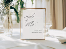 Framed printed wedding sign with 'cards & gifts' text on a table with decorative elements