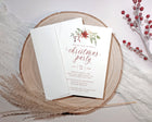Christmas party invitation card on a wooden surface with decorative elements