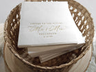 Elegant engagement napkin with “cheers to the future Mr & Mrs” in gold foil calligraphy