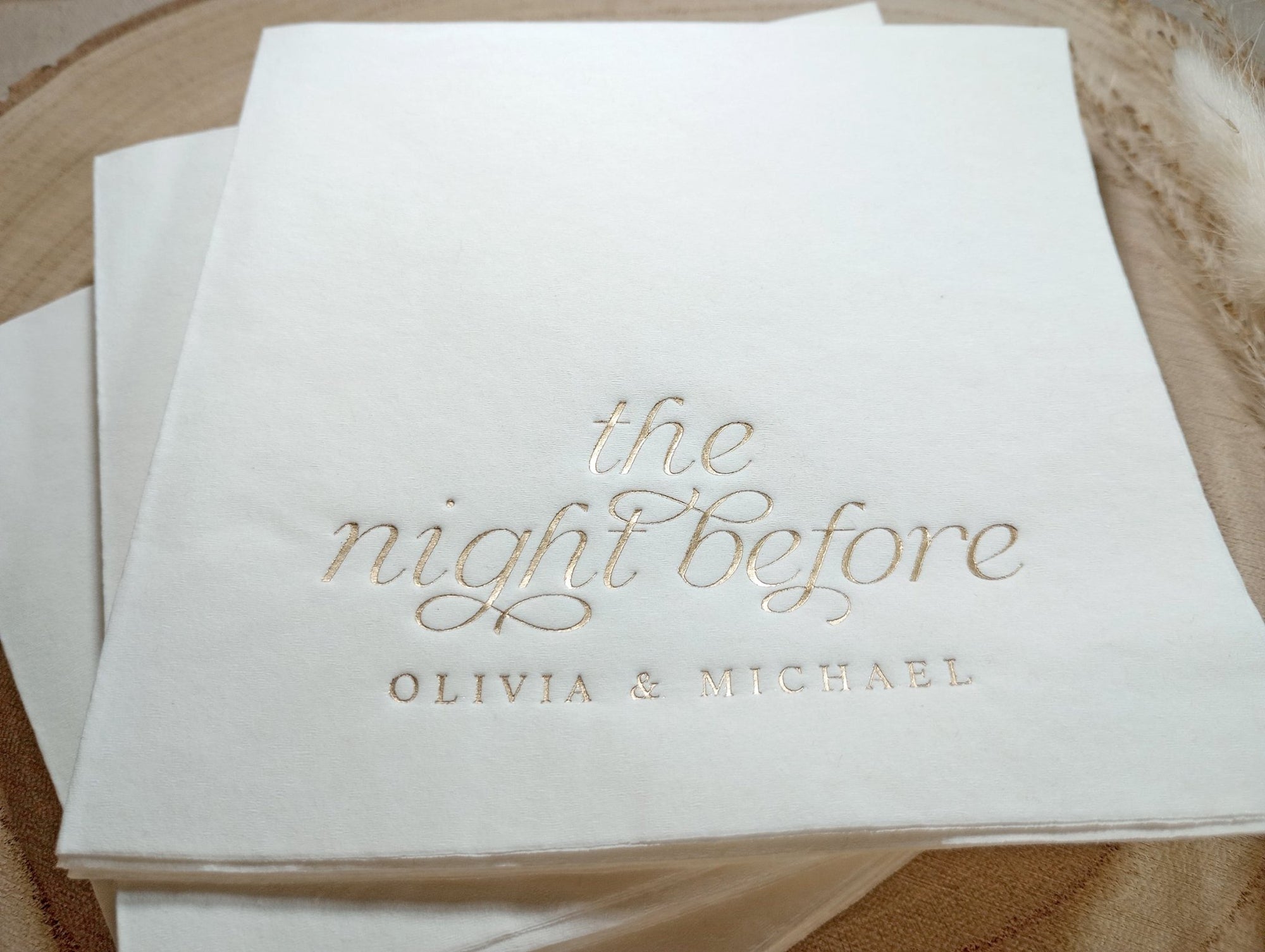 Close-up of metallic foil script on luxury rehearsal dinner napkin