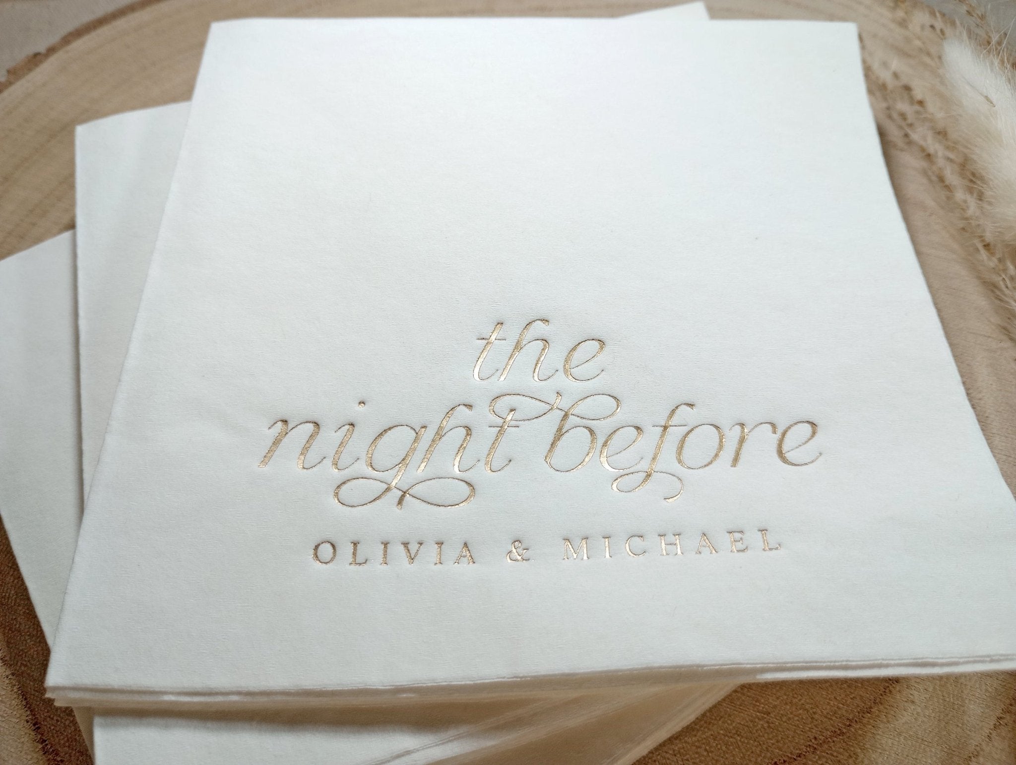 Close-up of metallic foil script on luxury rehearsal dinner napkin