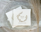 Personalized wedding napkins in gold foil with a boho vintage wreath design
