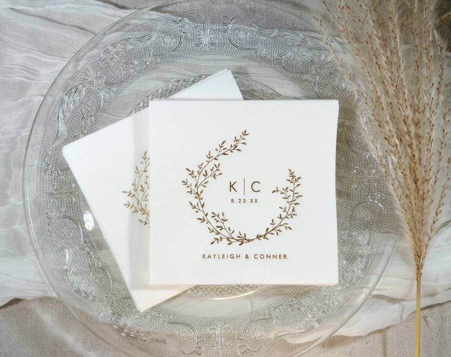 Personalized wedding napkins in gold foil with a boho vintage wreath design