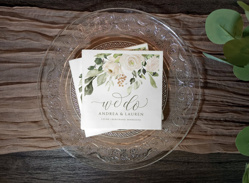 Wedding napkin with greenery, white flowers, and faux gold shimmer accents