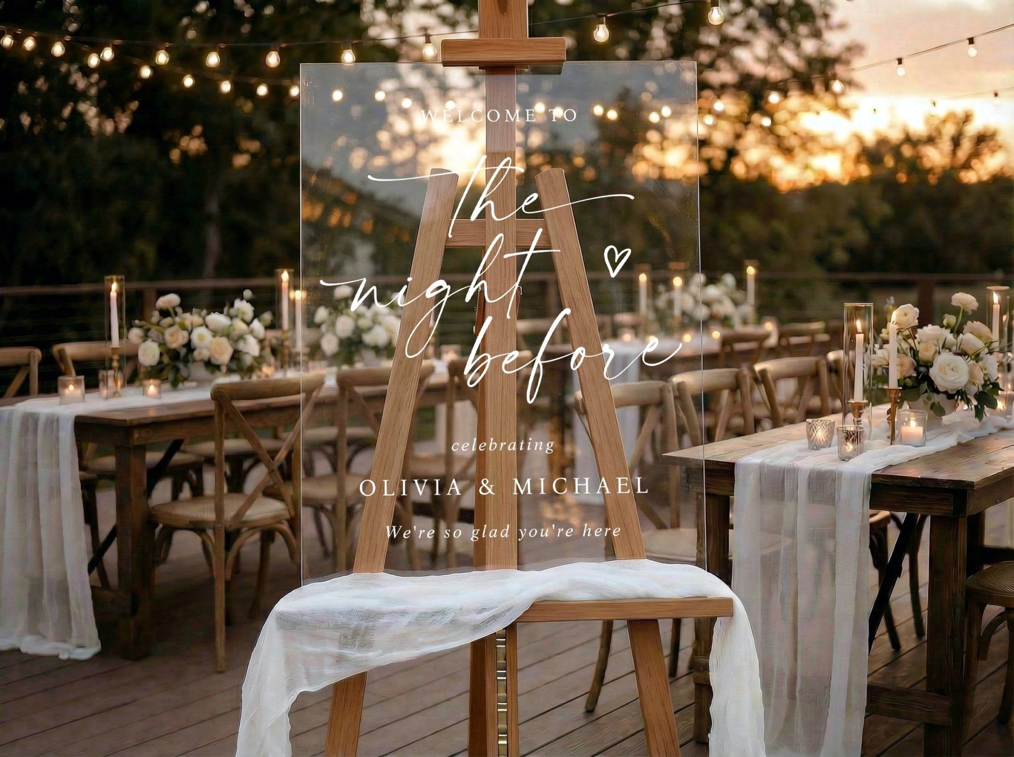 White acrylic rehearsal dinner welcome sign with script and heart accent