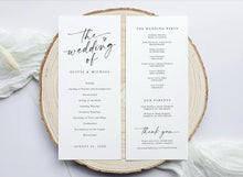 Wedding program on a wooden slice with a white background
