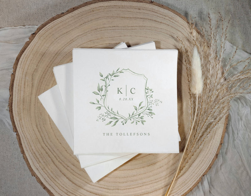 Sage green wedding napkins with traditional watercolor crest wedding logo