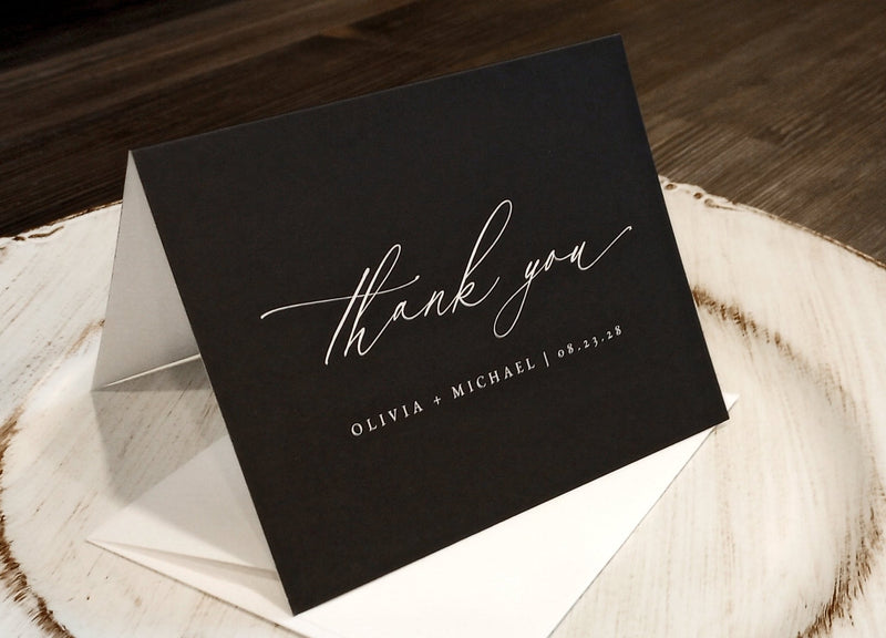 elegant black wedding thank you card with white vintage script and personalized names