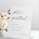 Freestanding “Photo Guestbook” wedding sign in romantic calligraphy with step-by-step instructions.