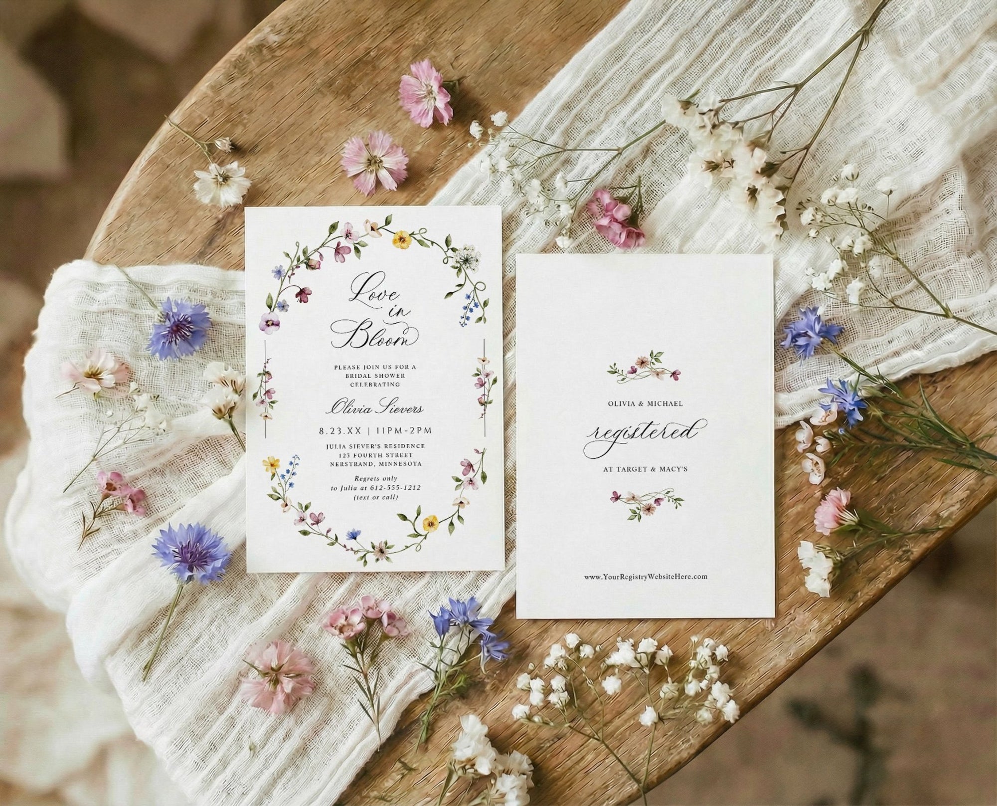 Bridal shower invitation with oval wildflower frame and watercolor flowers love is in bloom design