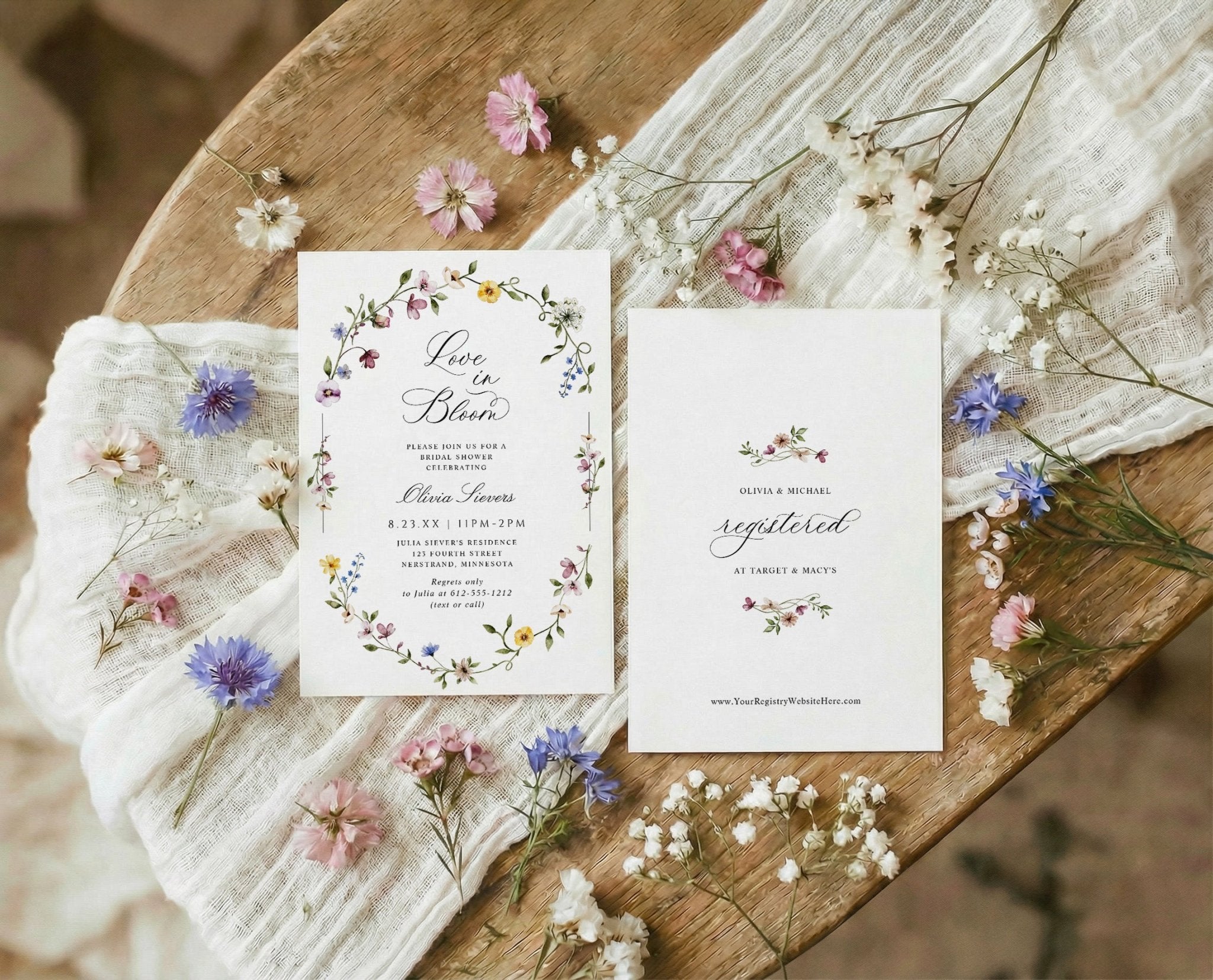 Bridal shower invitation with oval wildflower frame and watercolor flowers love is in bloom design