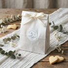 Elegant wedding favor stickers personalized with couple’s names and rehearsal dinner date