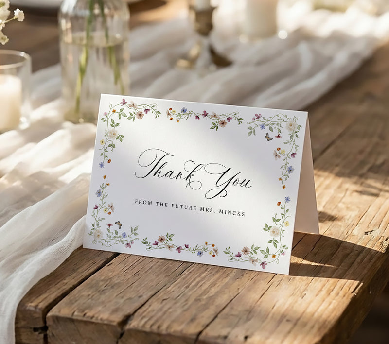 Folded bridal shower thank you card with watercolor wildflowers and elegant floral greenery