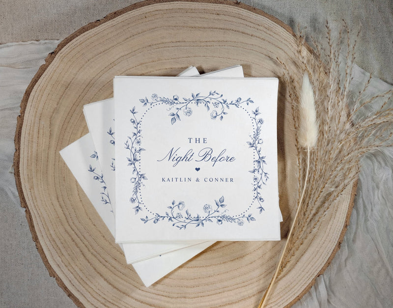 Vintage French navy blue rehearsal dinner napkins with elegant chinoiserie floral frame and "The Night Before" script.