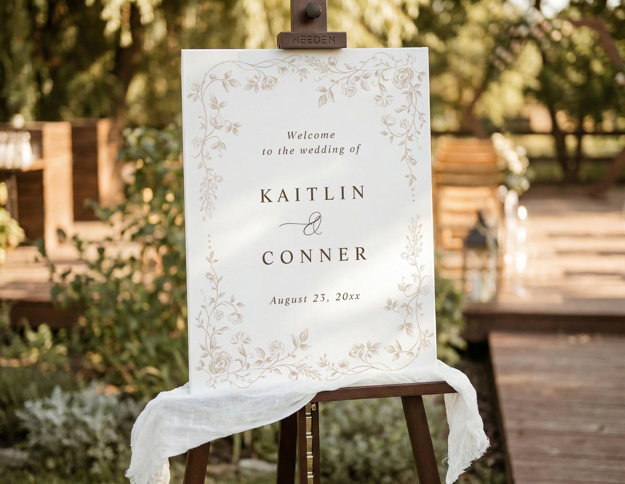 Beige vintage French floral wedding welcome sign on easel