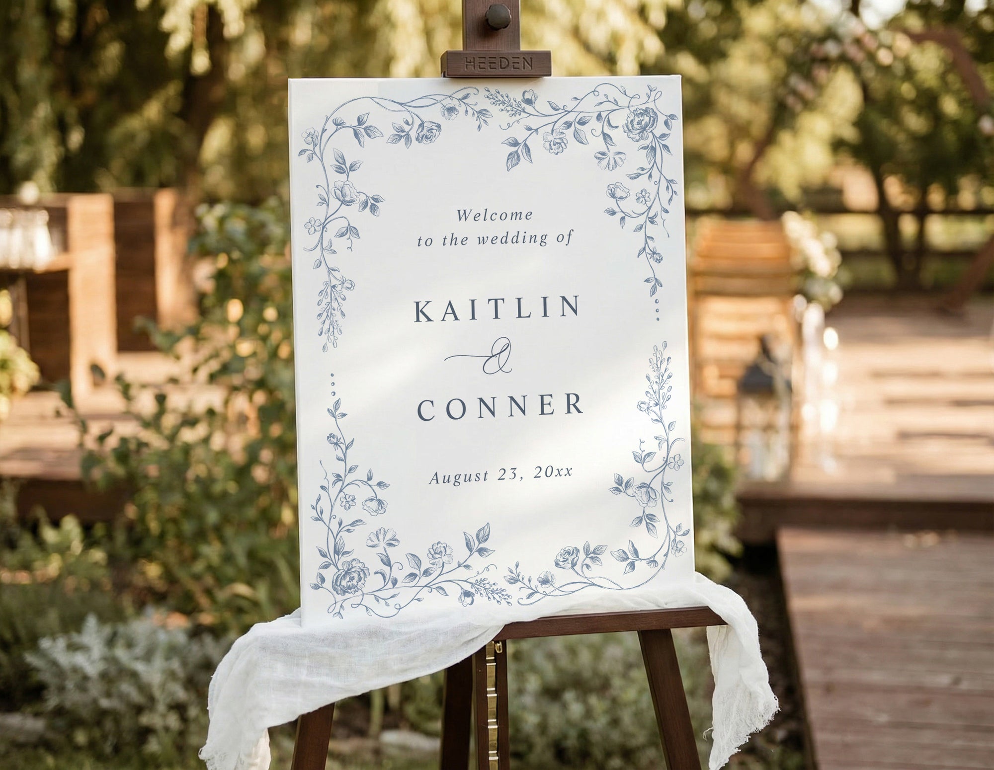 Dusty blue vintage French floral wedding welcome sign on easel