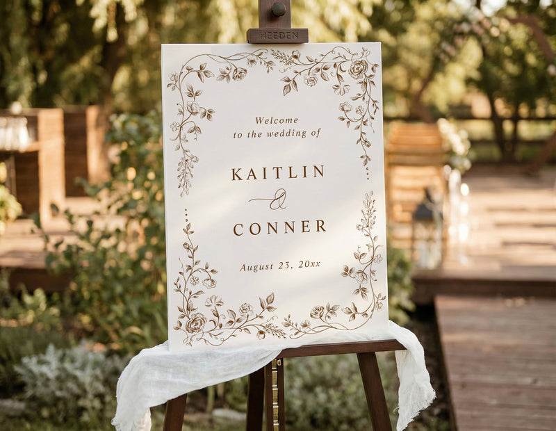 Brown vintage French floral wedding welcome sign on easel
