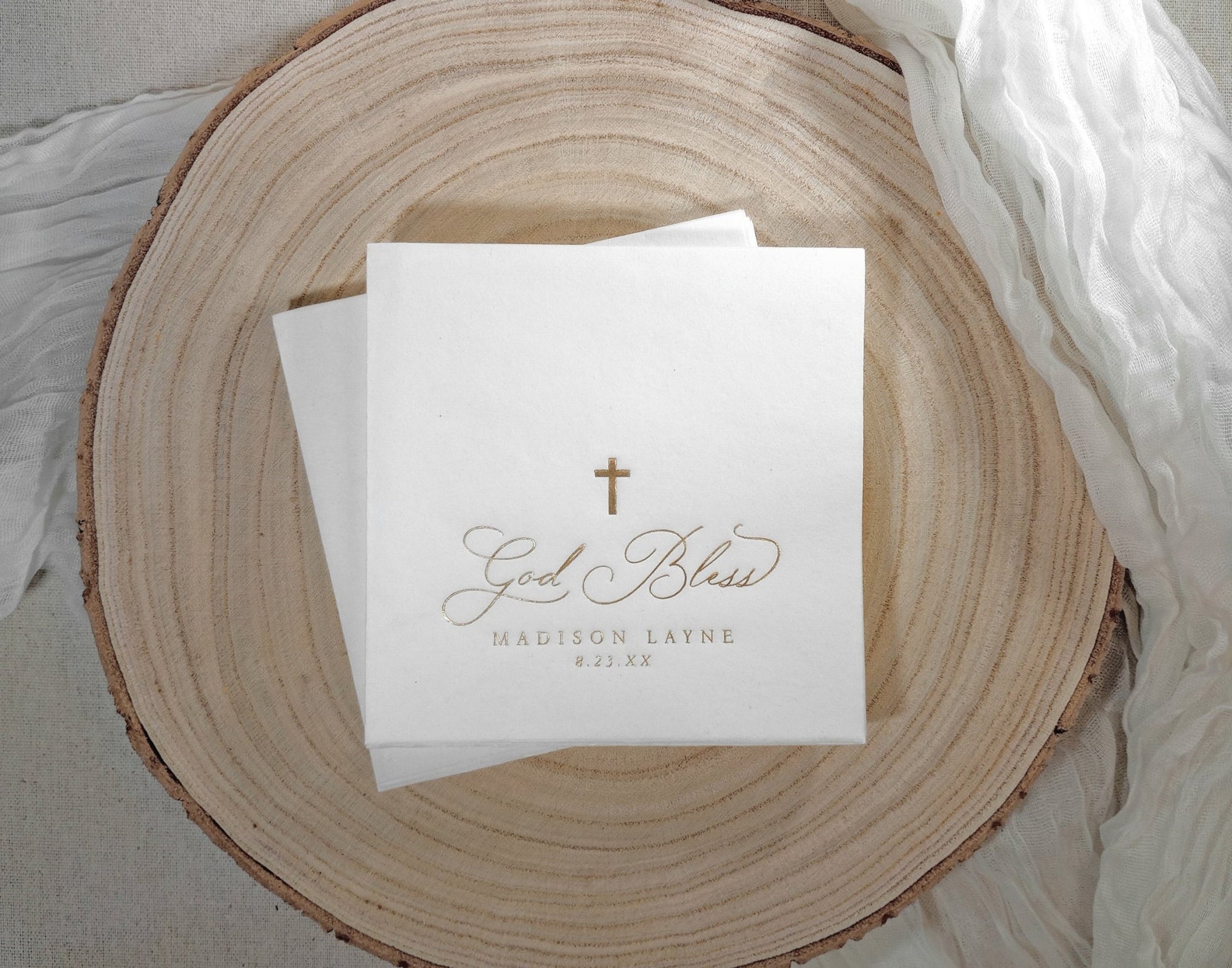 White paper napkin for baptism or christening with gold foil stamped cross