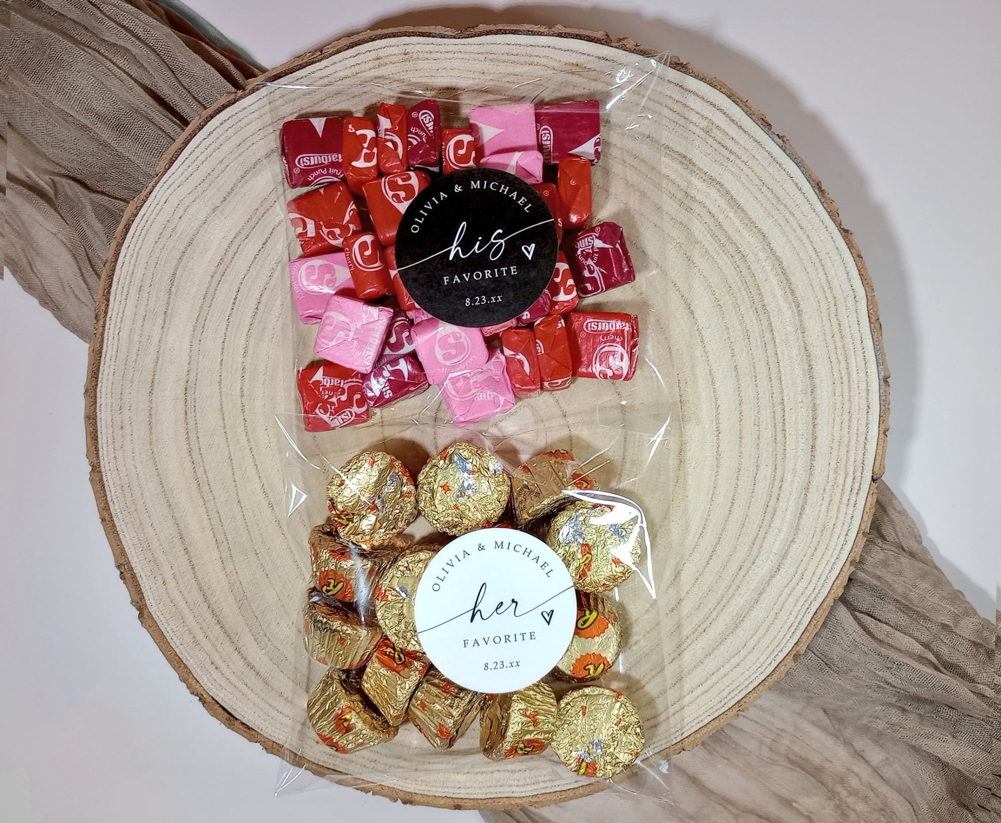 Bowl with chocolates labeled 'His Favorite' and 'Her Favorite' on a wooden surface.