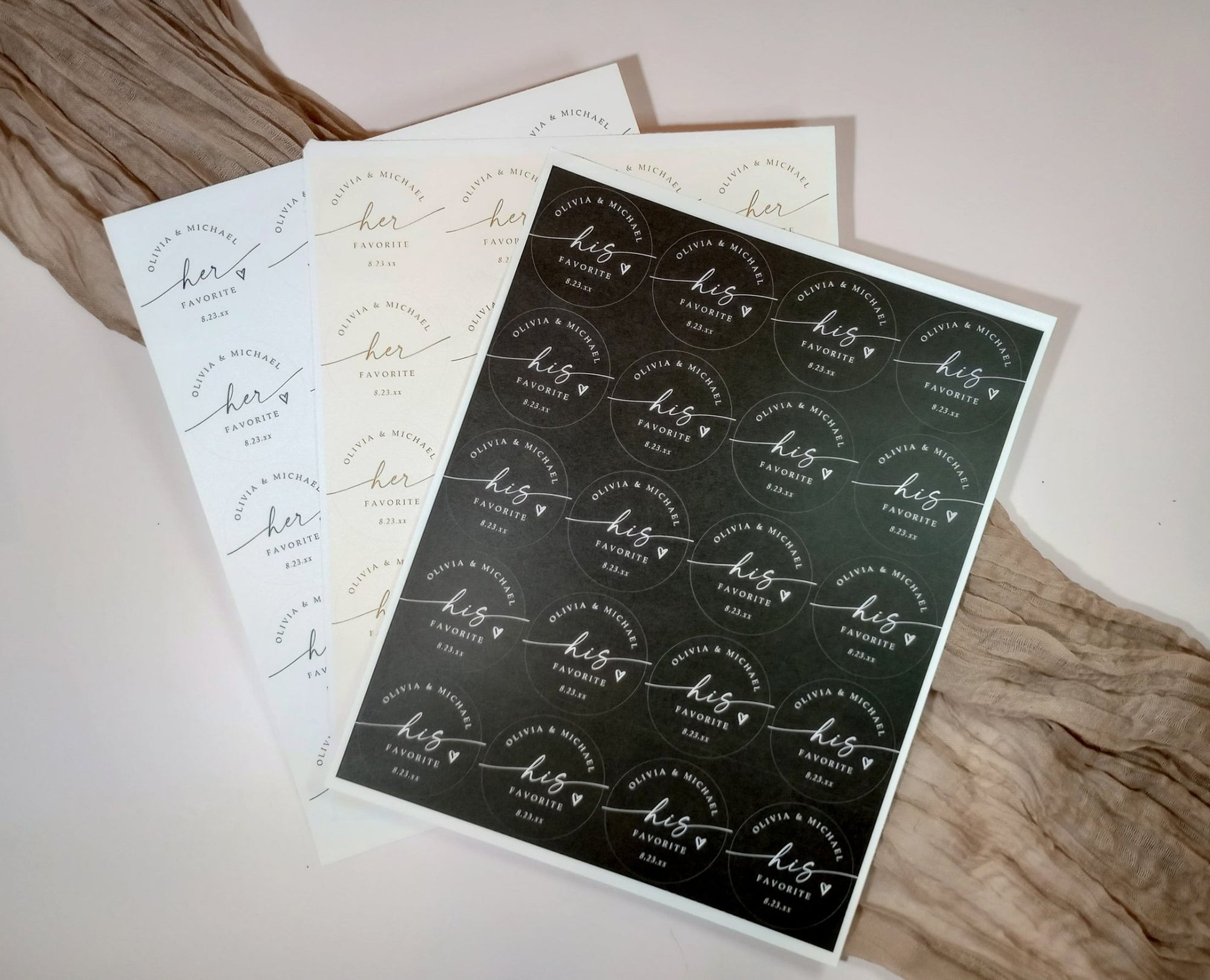 Set of personalized stickers with 'his favorite' and 'her favorite' text on a wooden surface