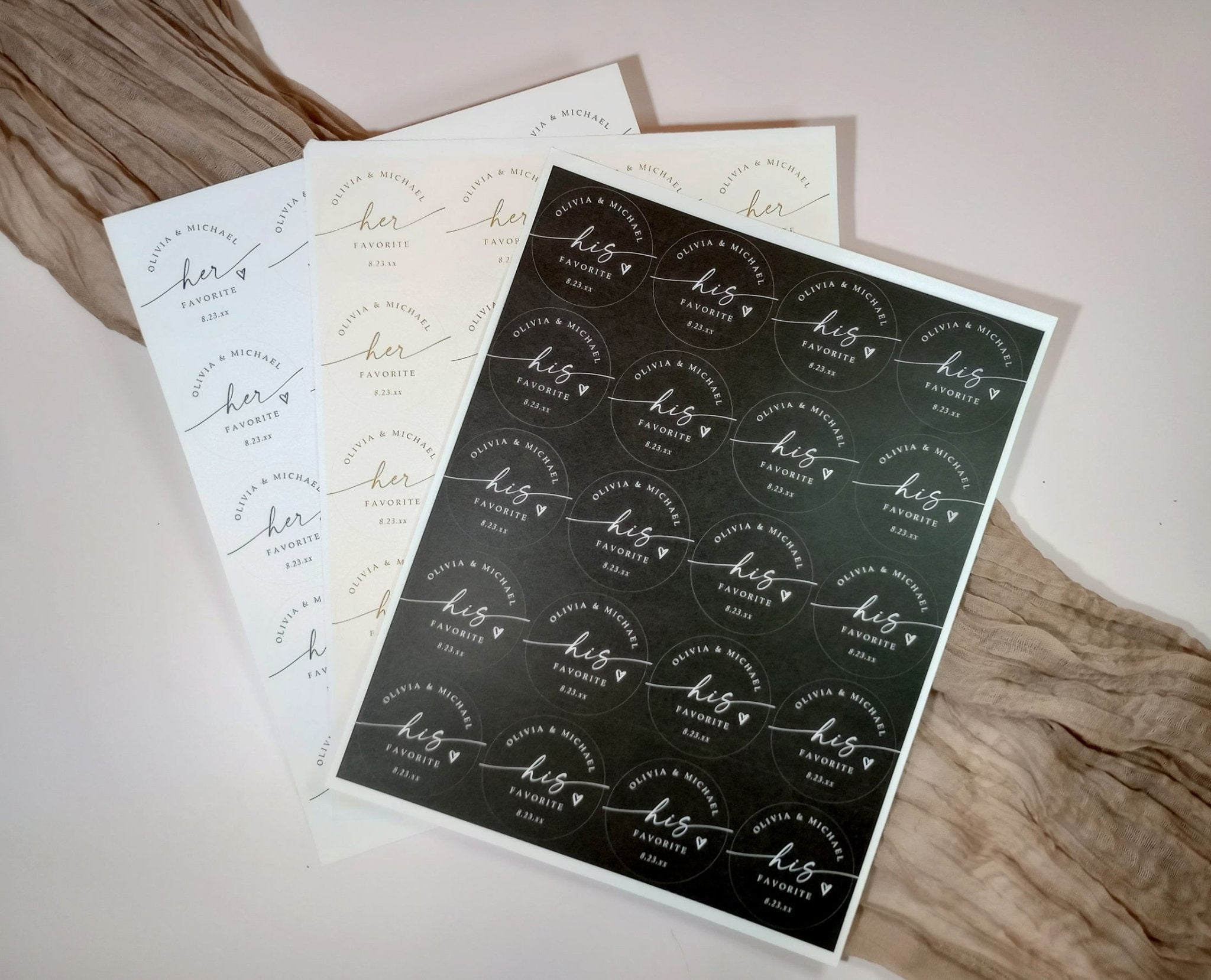 Set of personalized stickers with 'his favorite' and 'her favorite' text on a wooden surface