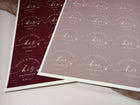 Two sheets of personalized stickers with 'his favorite' and 'her favorite' text on a white surface.