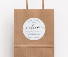 Close-up of personalized welcome sticker featuring modern script design